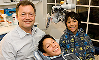 Sydney dentist Nick Hocking kicked off Bright Smiles by treating Jerson and Caleb Hidalgo